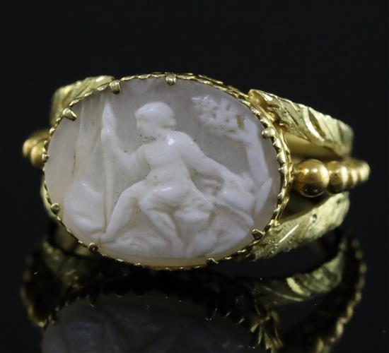 A 19th century two colour gold and oval cameo set ring, size F.